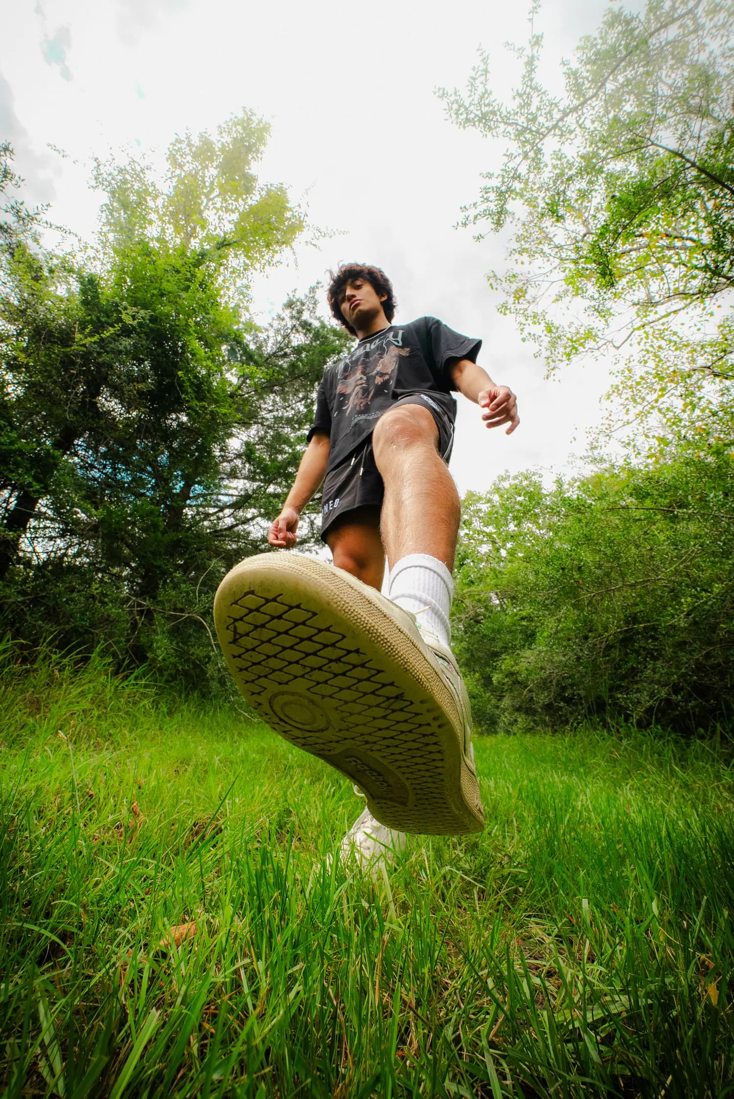 Motion frame, mid-kick in long grass