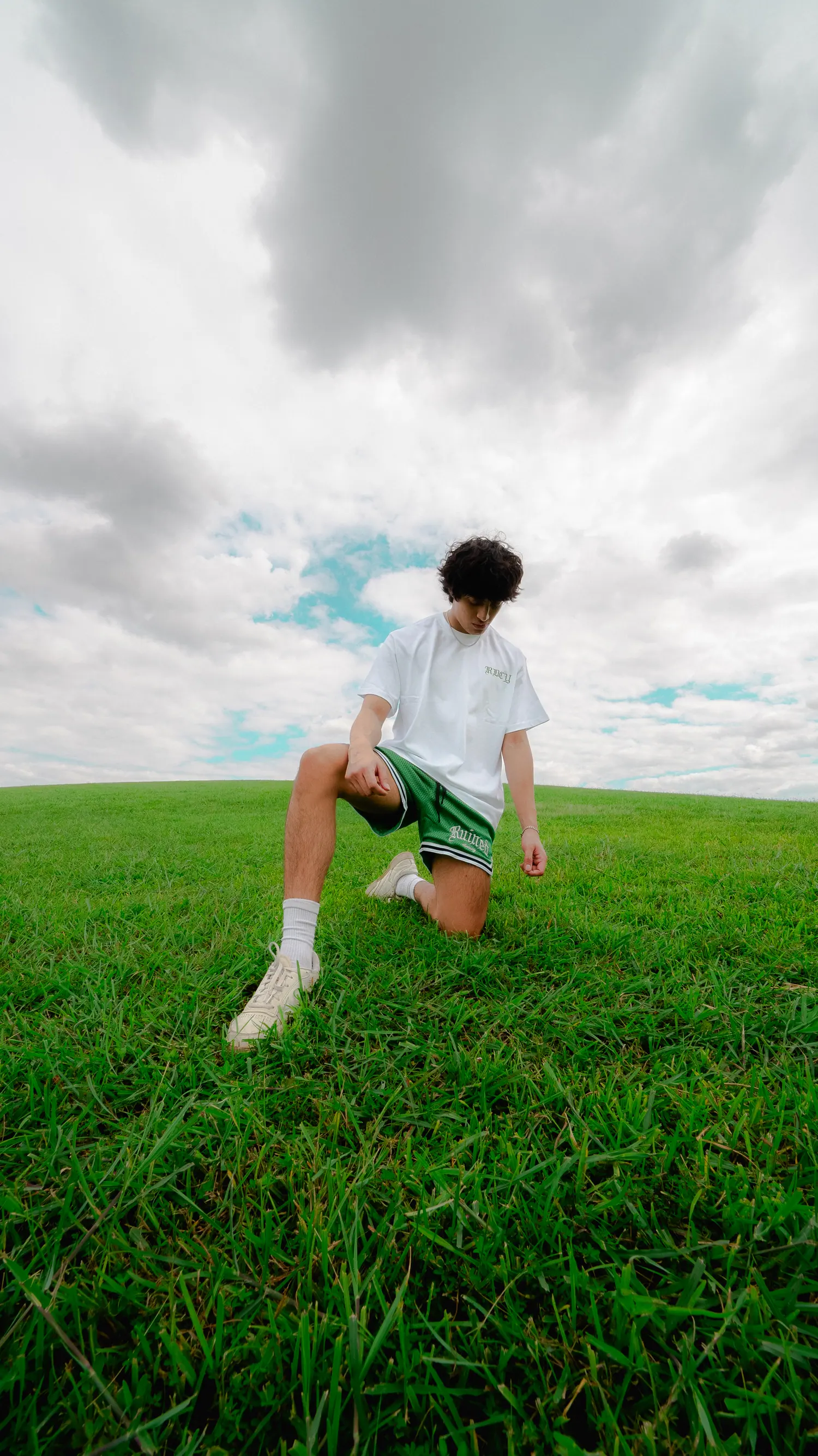 Editorial shot in an open field under heavy cloud