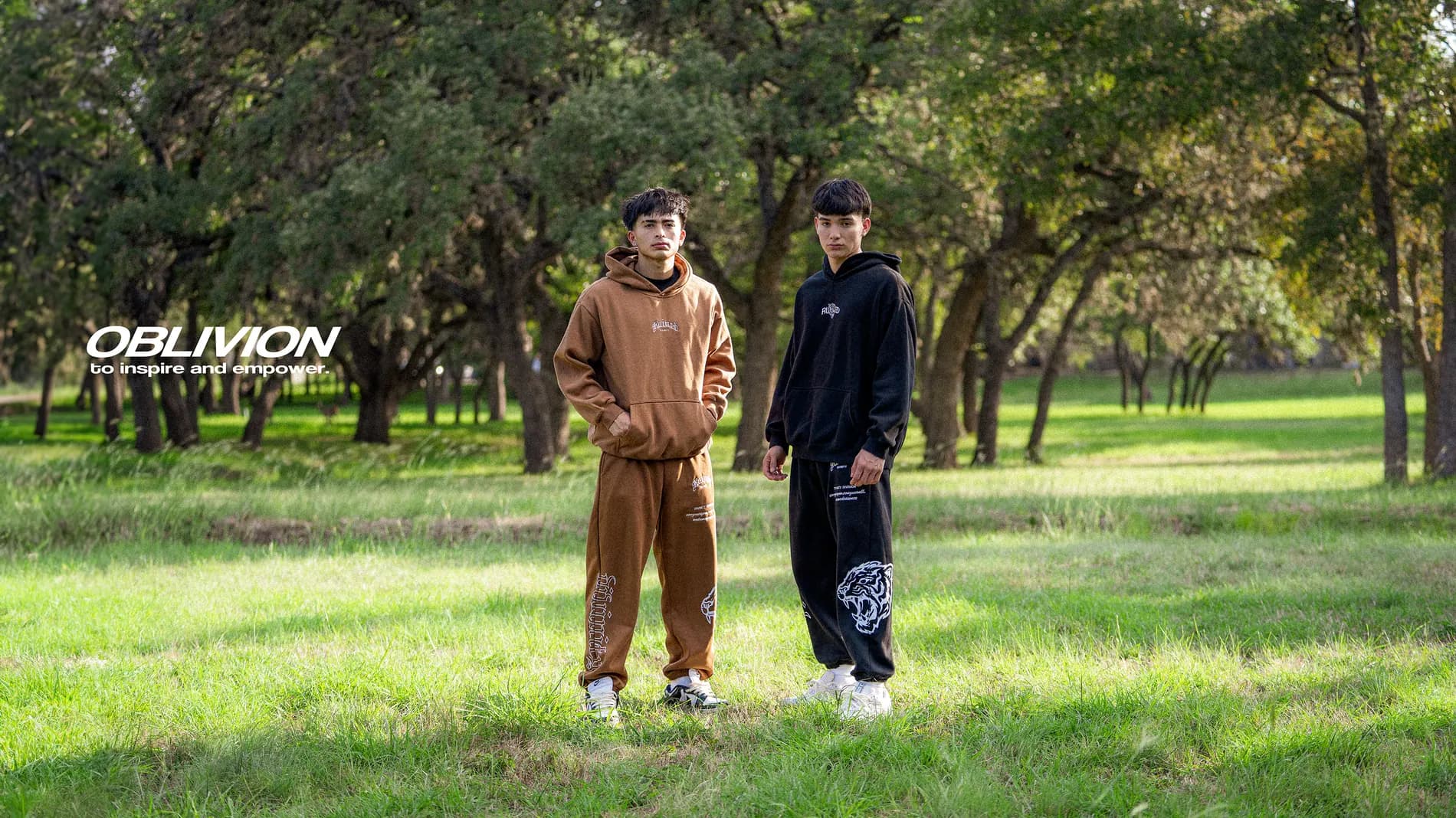 Oblivion campaign banner — two models in a park wearing the season's fleece